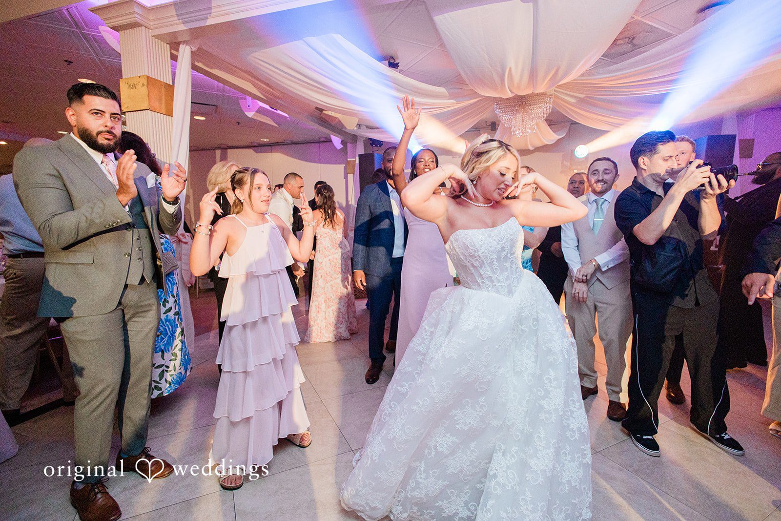 Jackie + Will Bride and groom dancing under draped lights
