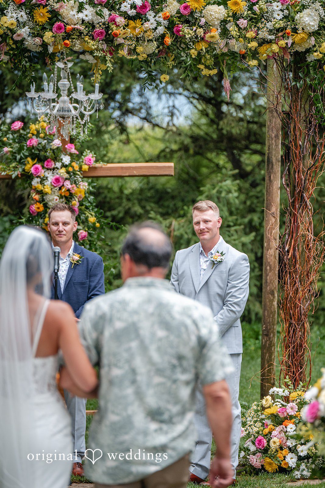 Couple with the officiant during the ceremony