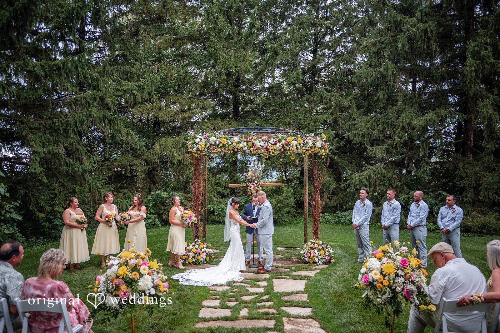 Wide view of the ceremony with the wedding party at Ashley Farm