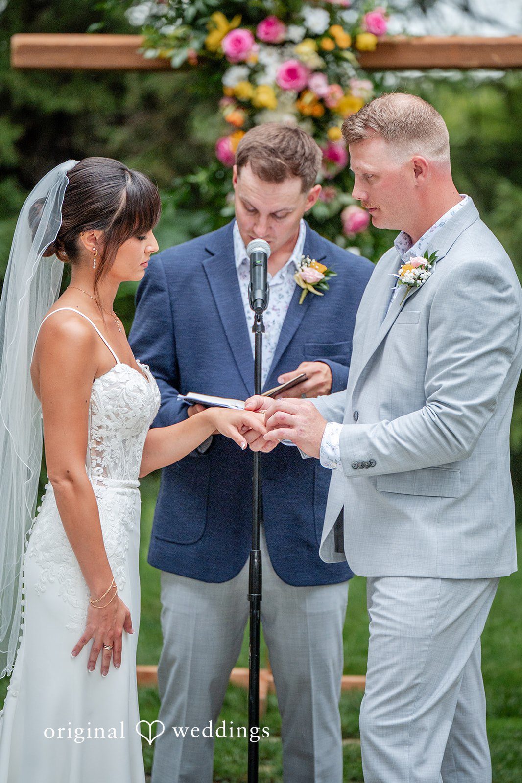 Couple exchanging rings at the ceremony