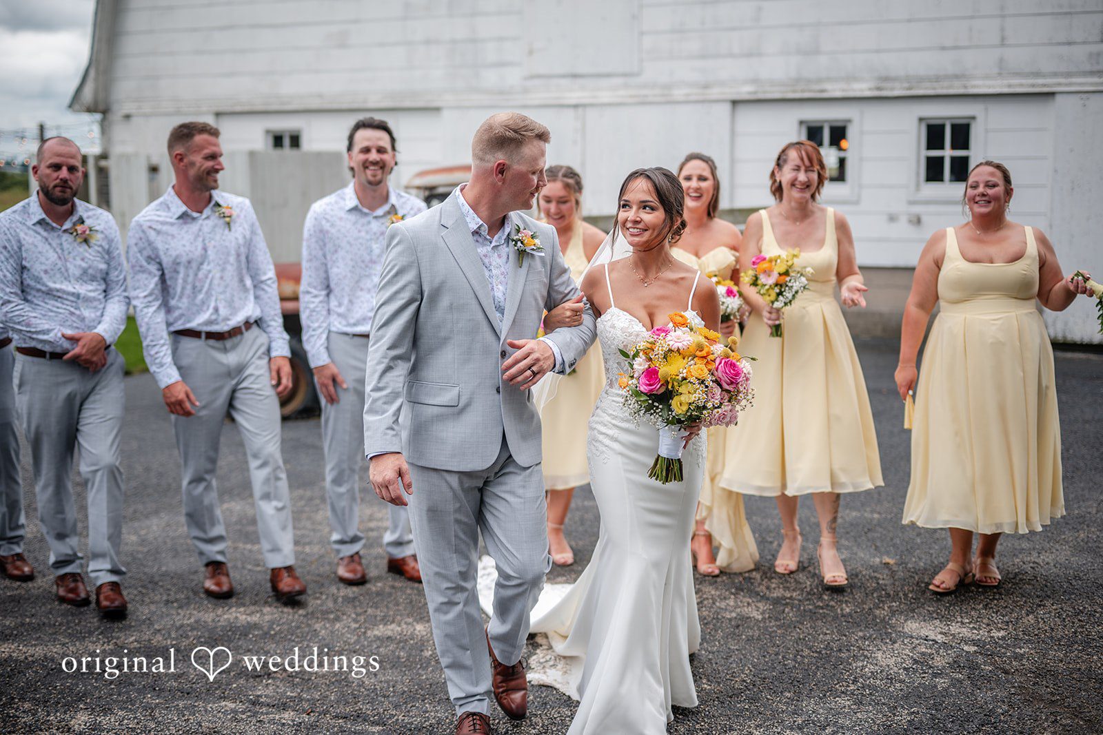 Wedding party walking and laughing together