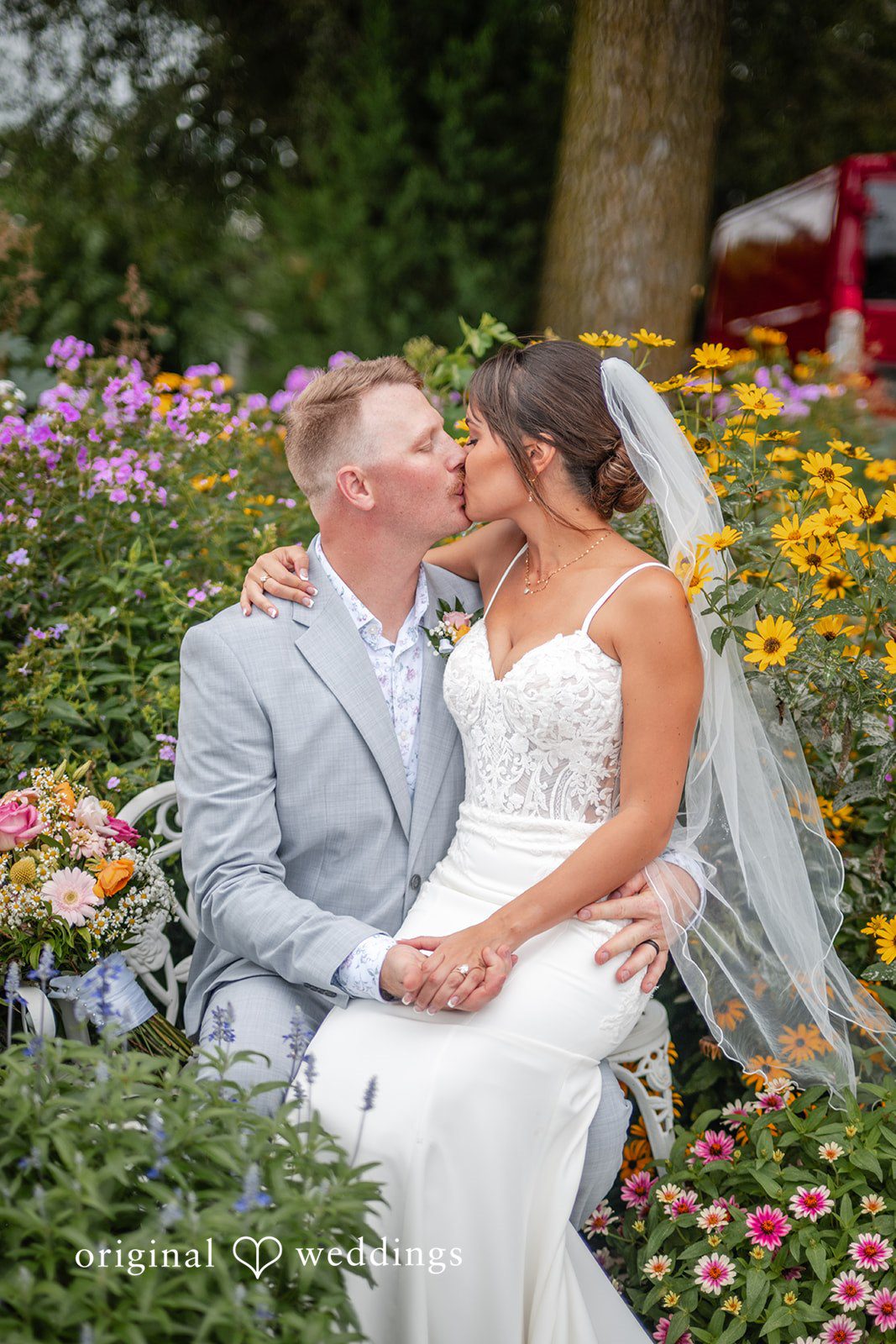 Couple sharing a close moment among the flowers