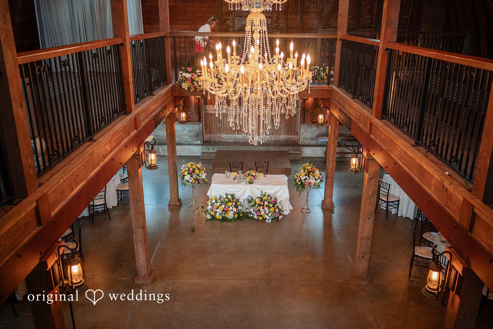 Barn interior with a crystal chandelier at Ashley Farm