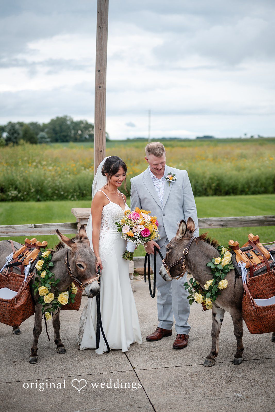 Couple posing with farm animals