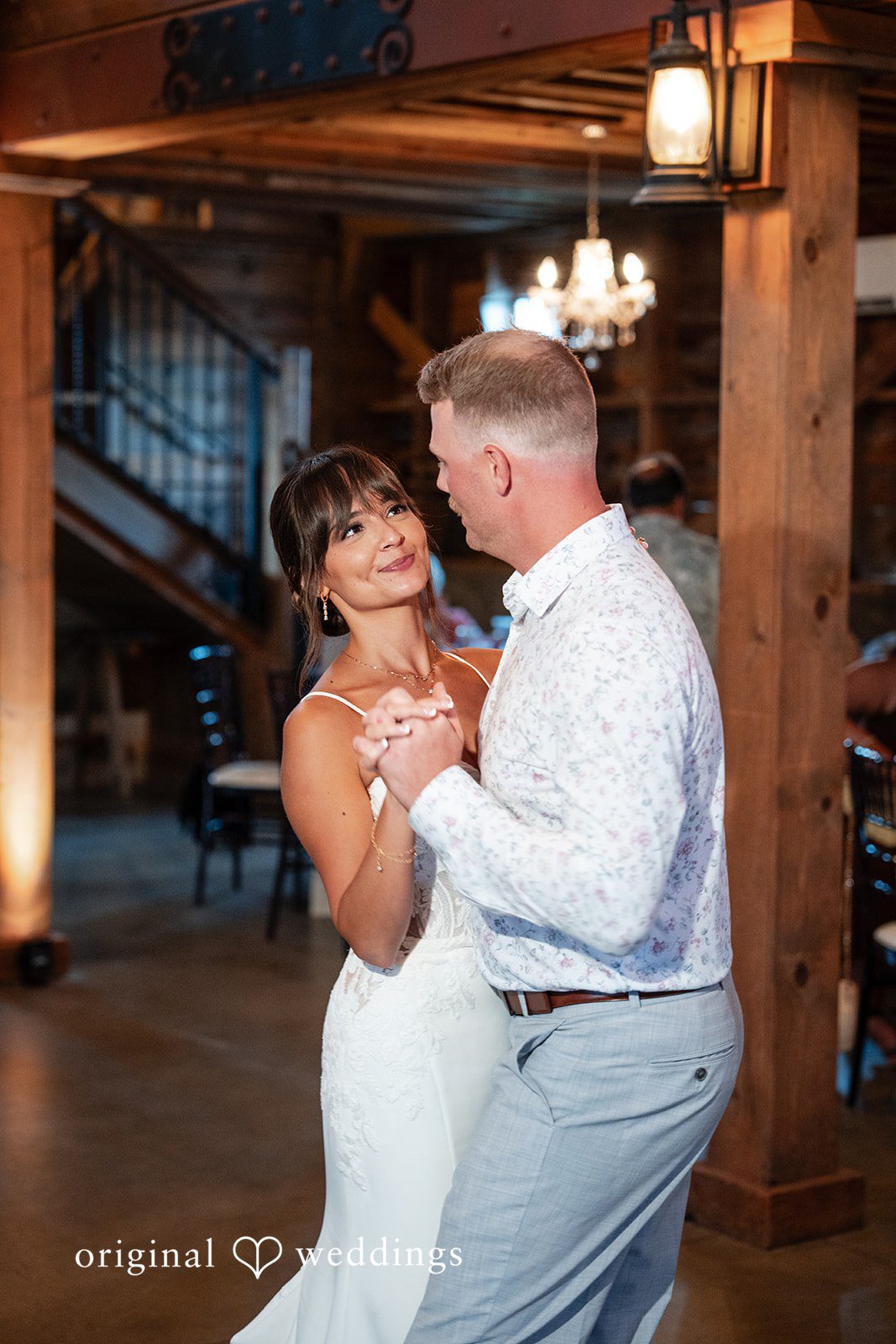 Couple slow dancing in the barn at Ashley Farm