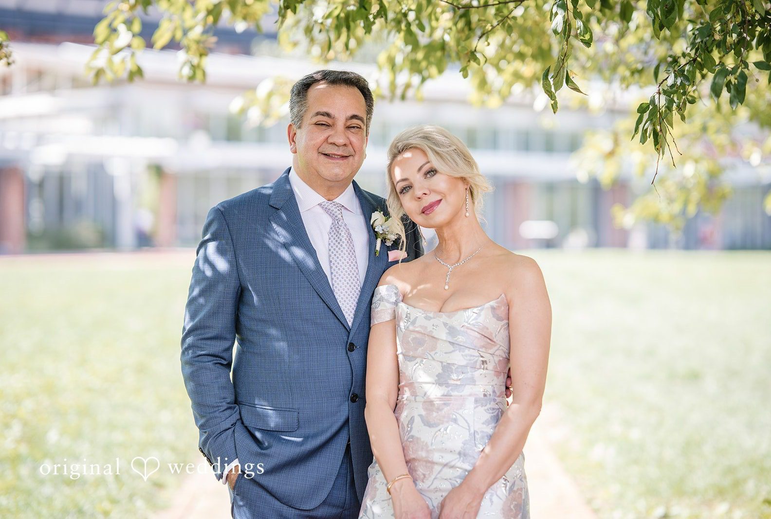 Bride and groom smiling together in the park, captured by Philadelphia wedding photographers from Original Weddings at Barclay Prime