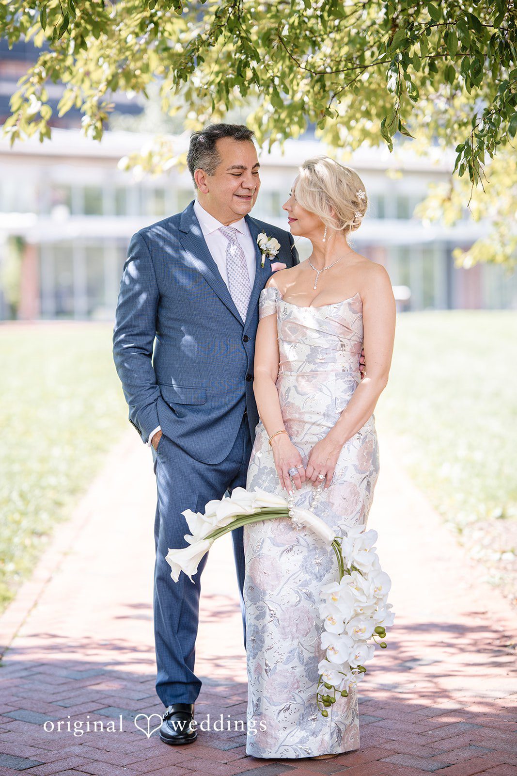 Alexandra + John Couple standing on a brick path at Barclay Prime