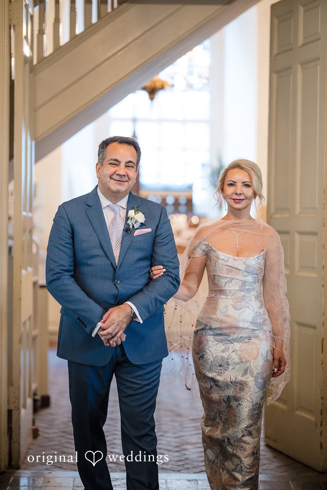 Alexandra + John Couple smiling inside a historic hall