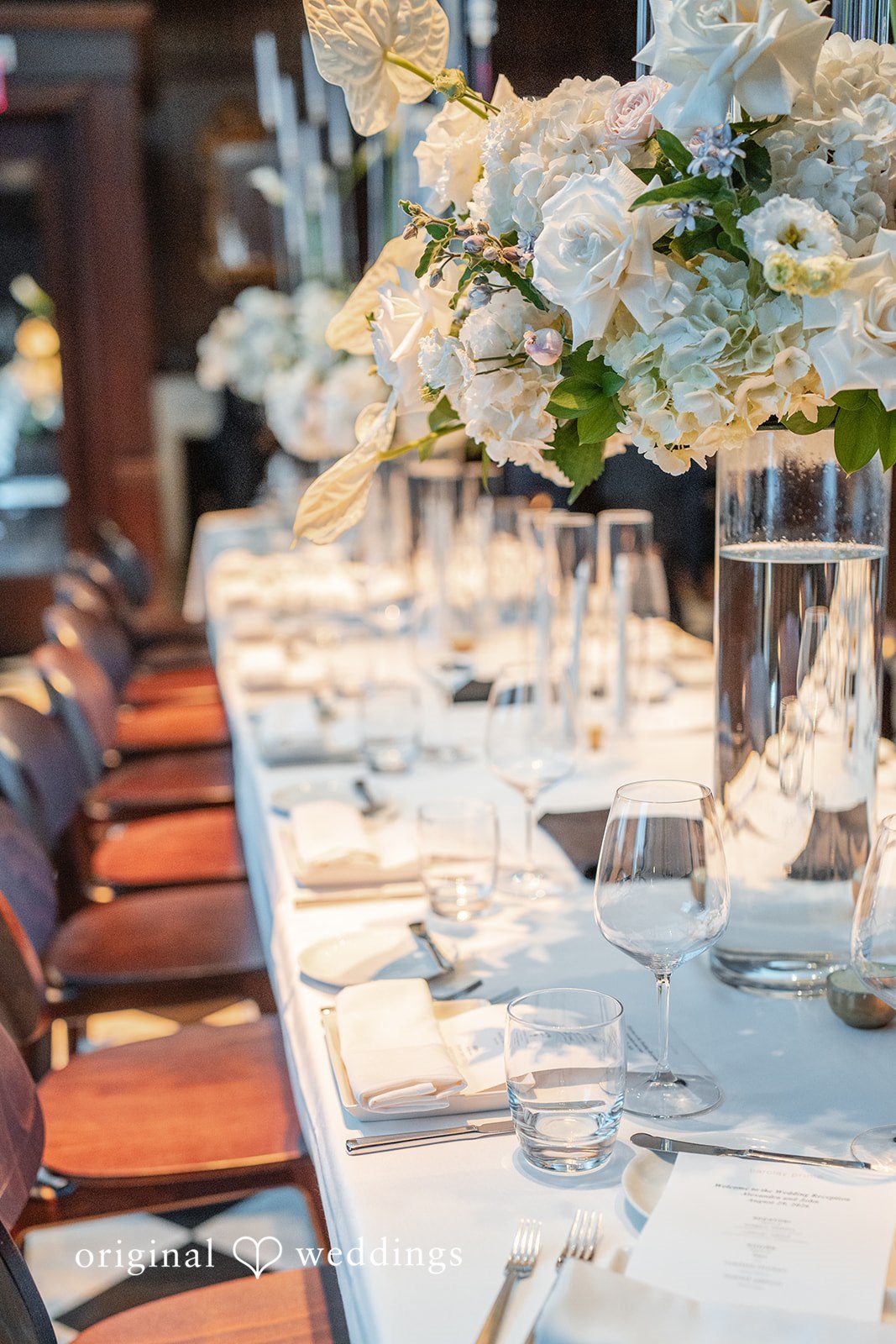 Alexandra + John Elegant reception table with white flowers by Philadelphia wedding photographers at Barclay Prime