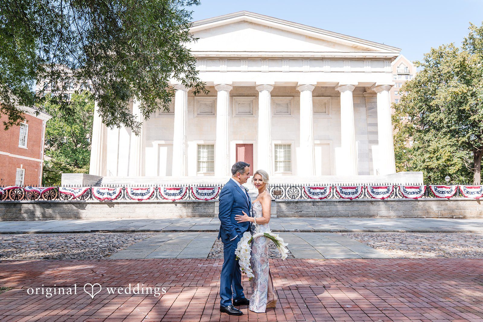 Alexandra + John Couple in front of a historic building at Barclay Prime