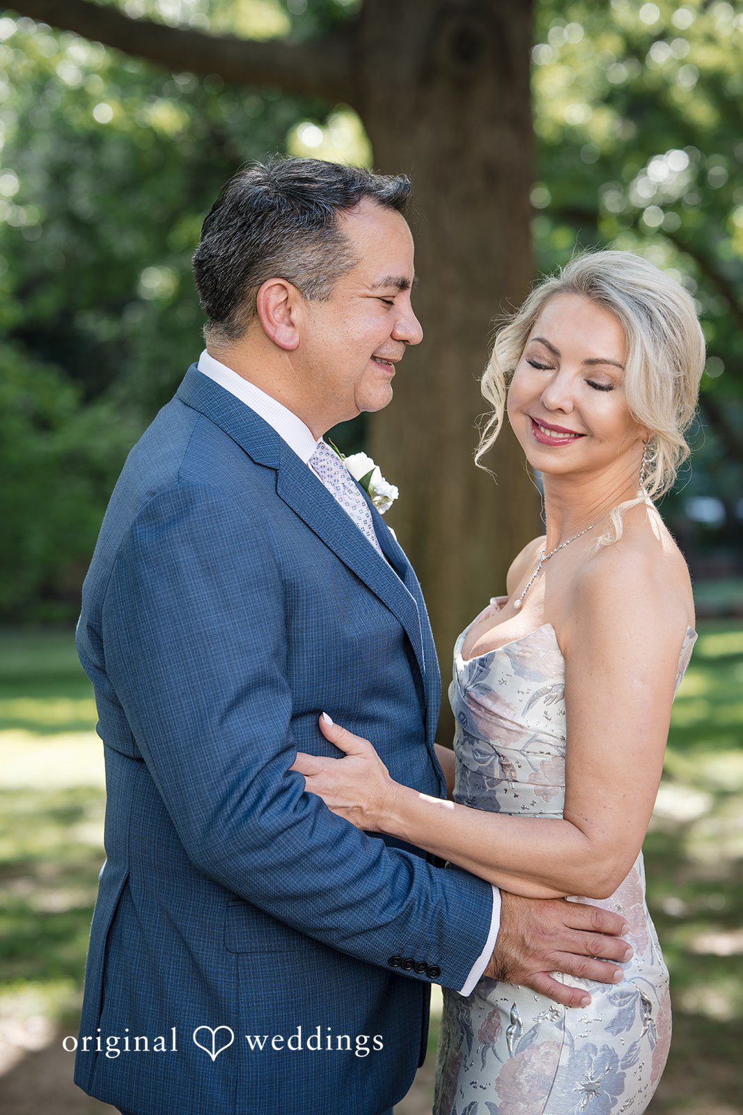 Alexandra + John Couple embracing under the trees at Barclay Prime