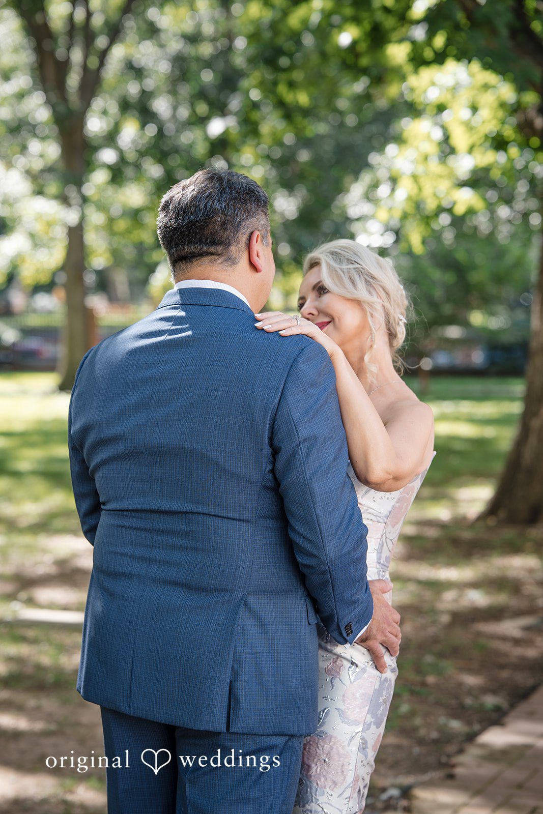 Alexandra + John Bride wiping a happy tear beside the groom