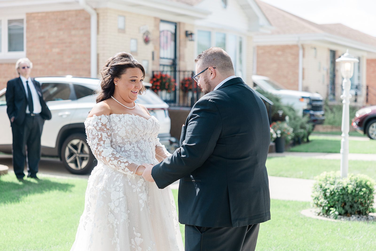 Bride with her father outside the family home