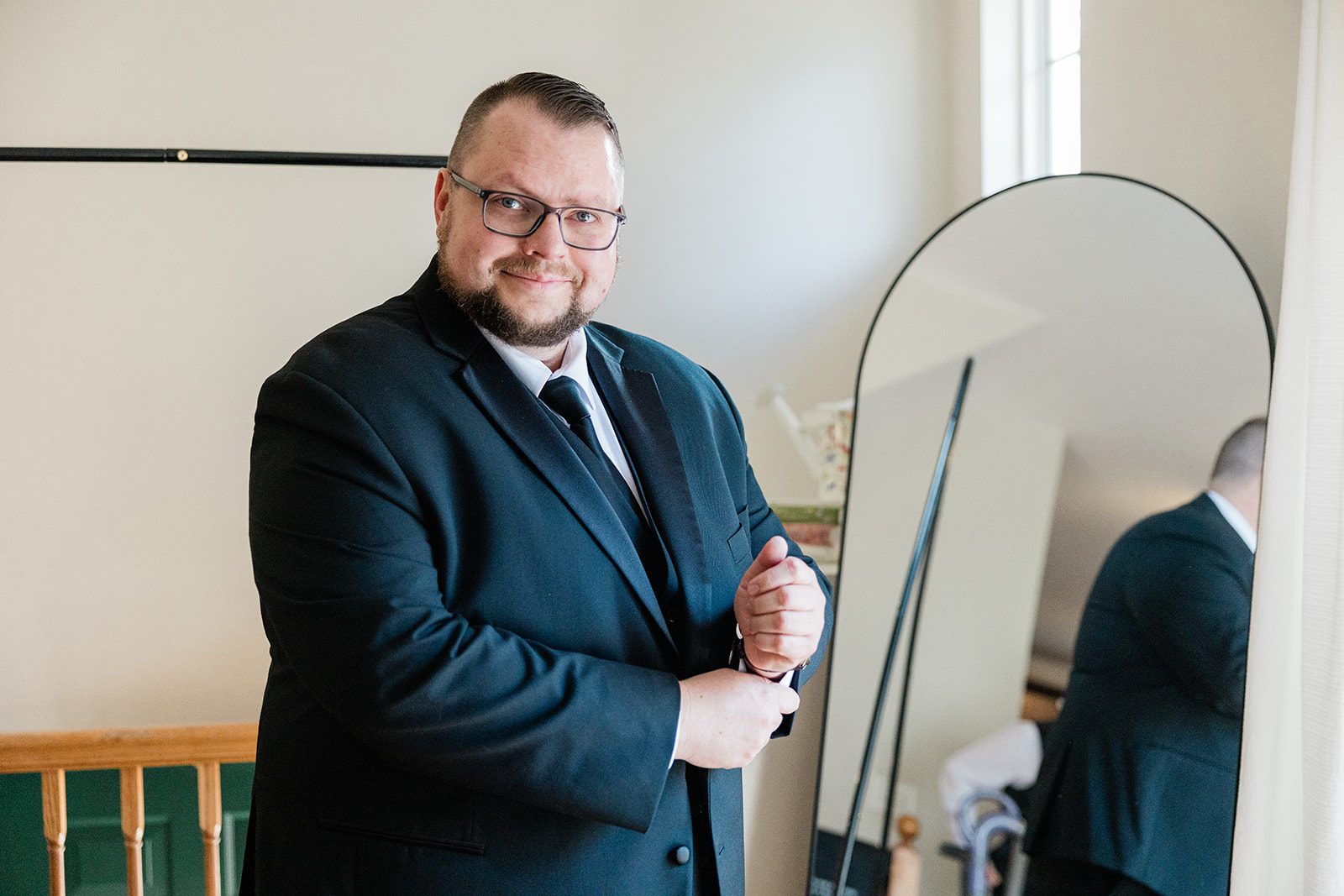 Groom ready in his black suit