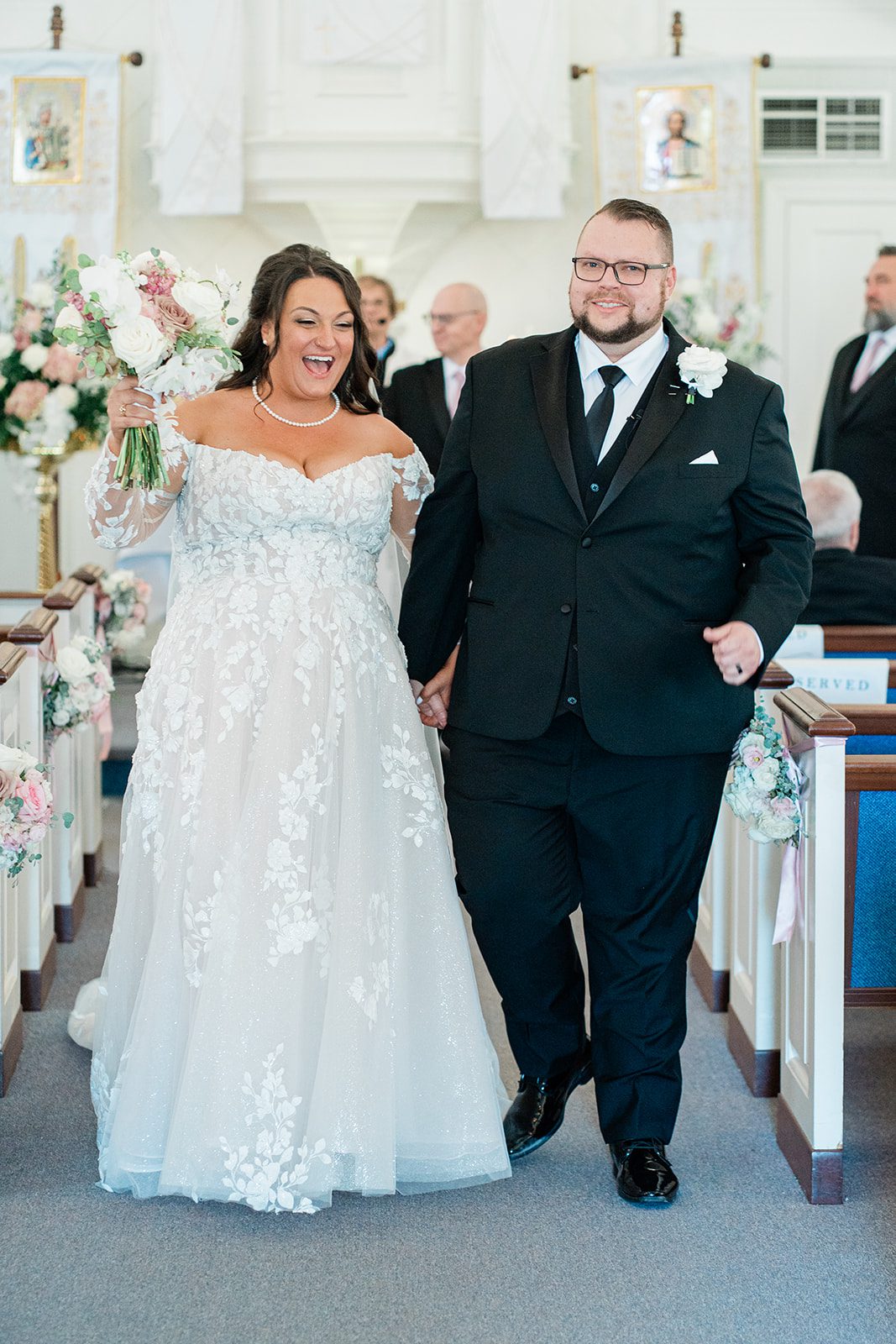 Newlyweds walking back down the aisle