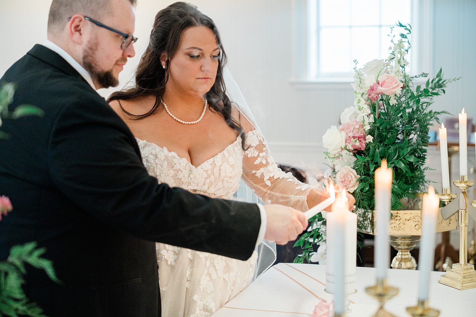 Couple lighting the unity candle