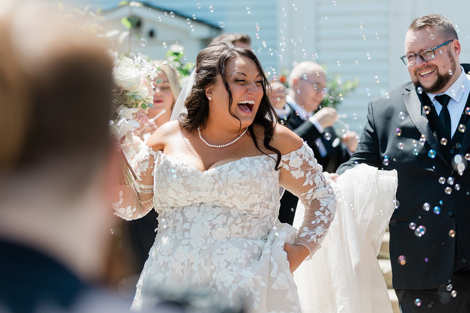Bride laughing during the bubble send off