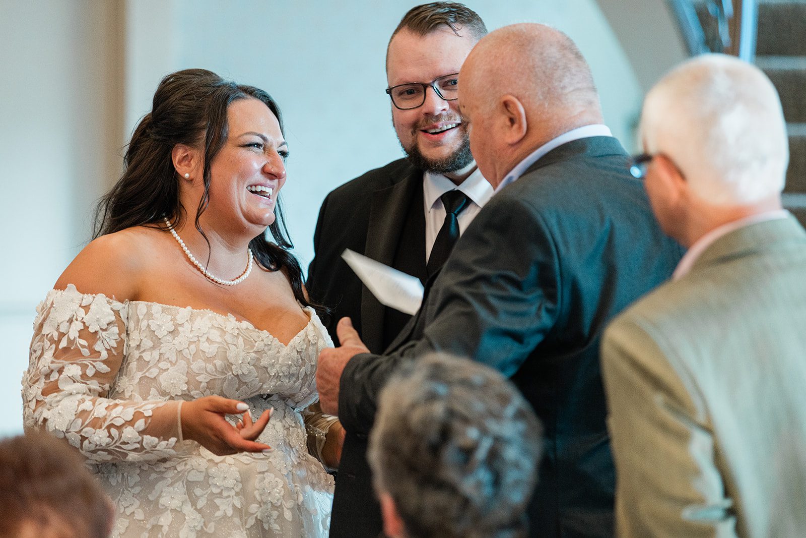 Newlyweds greeting family after the ceremony