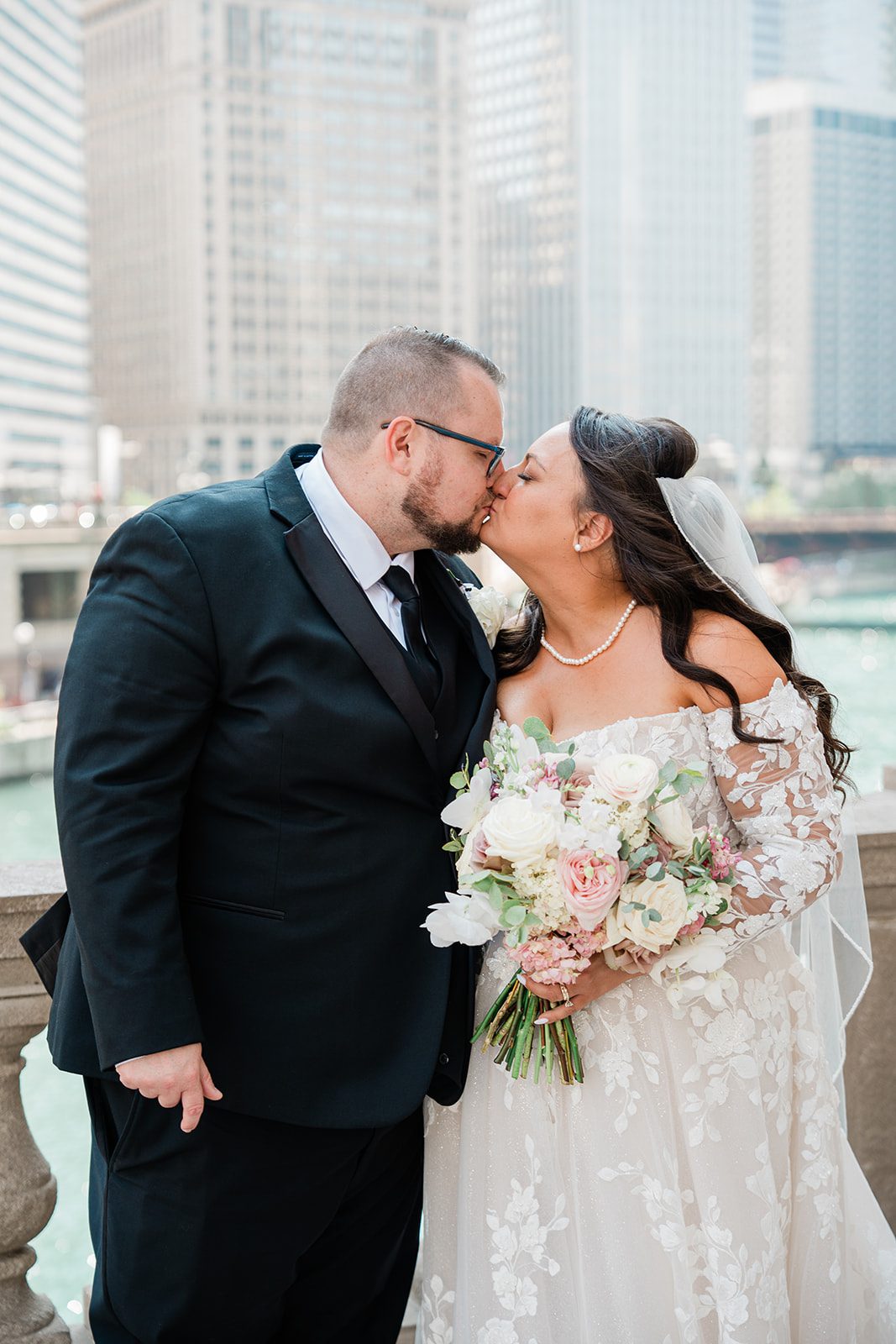 Couple touching foreheads on the Chicago riverwalk
