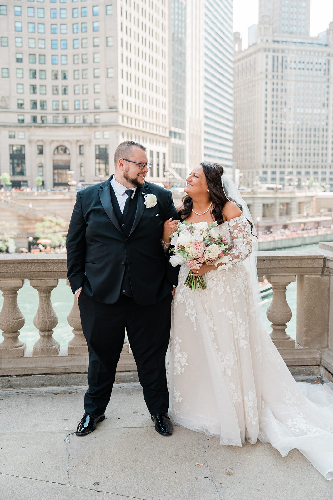 Bride and groom standing together downtown, captured by Chicago wedding photographers from Original Weddings at Belvedere & Co. Events