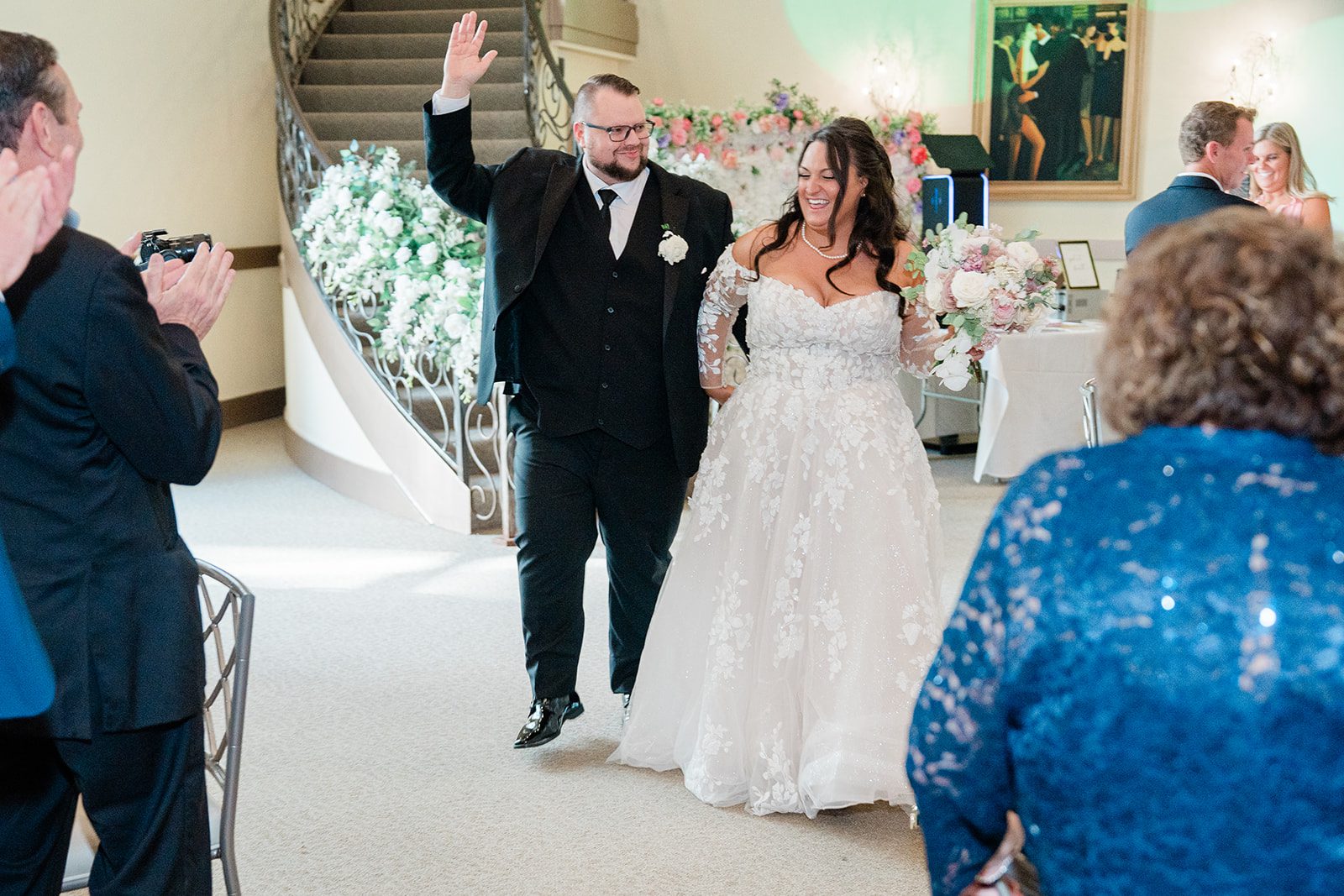 Couple entering the reception to cheers