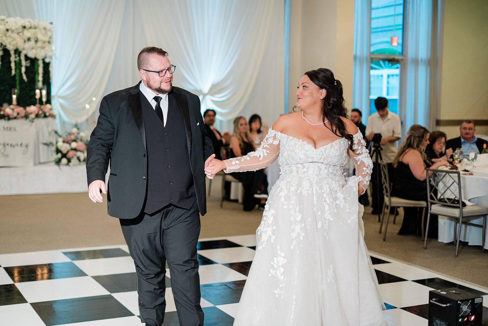 Bride and groom in the reception hall at Belvedere & Co. Events
