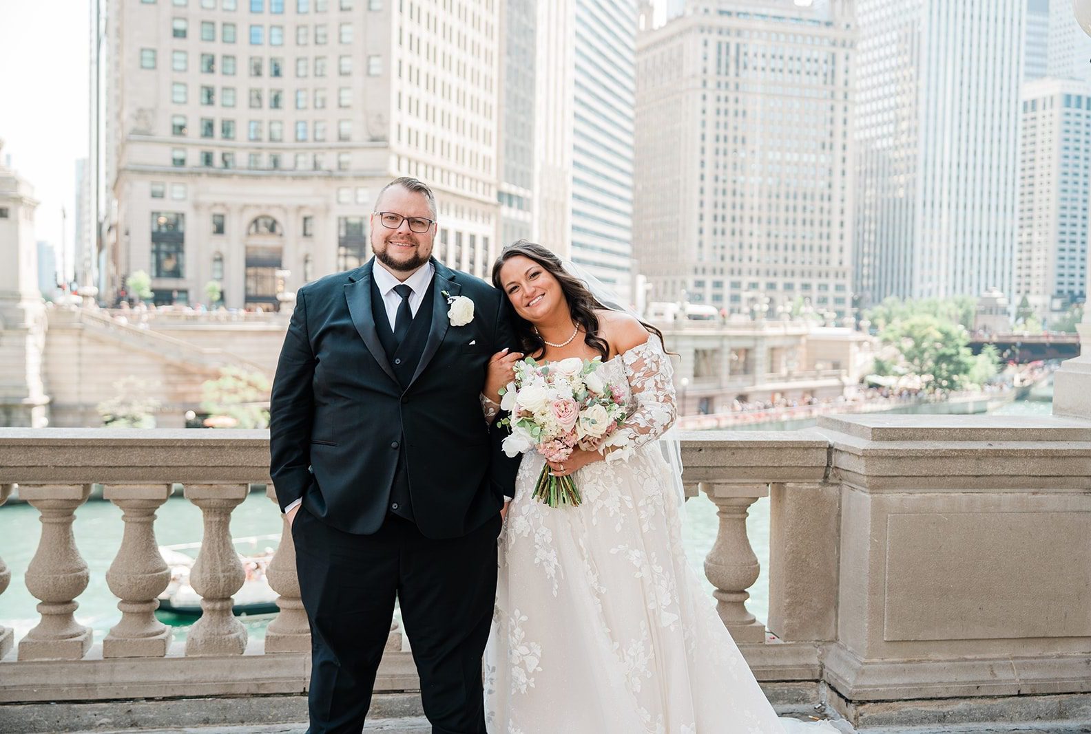 Bride and groom smiling with the Chicago skyline behind them, captured by Chicago wedding photographers from Original Weddings at Belvedere & Co. Events