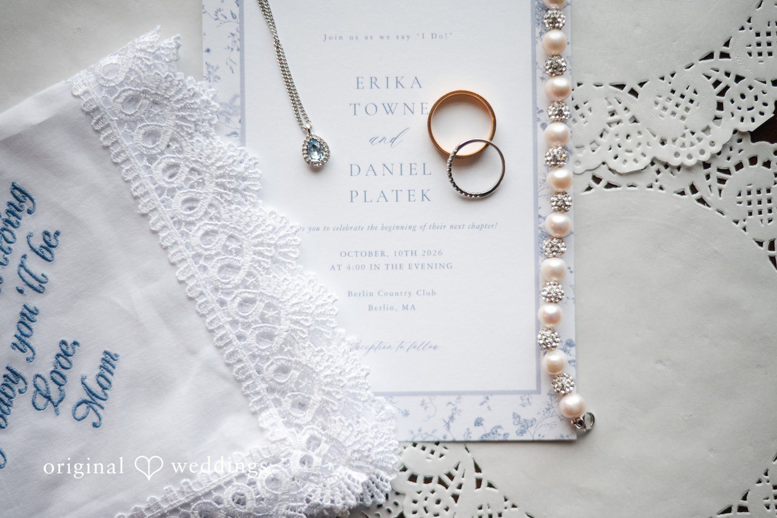 Wedding rings on the invitation suite