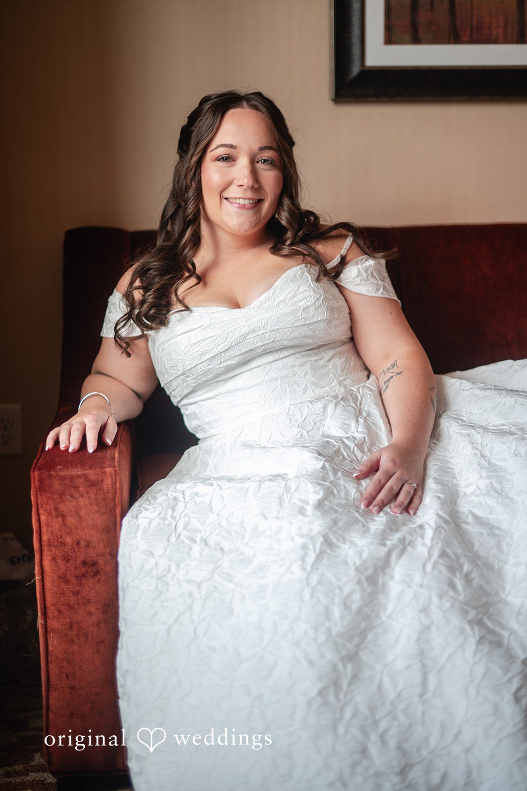 Bride seated in her wedding dress