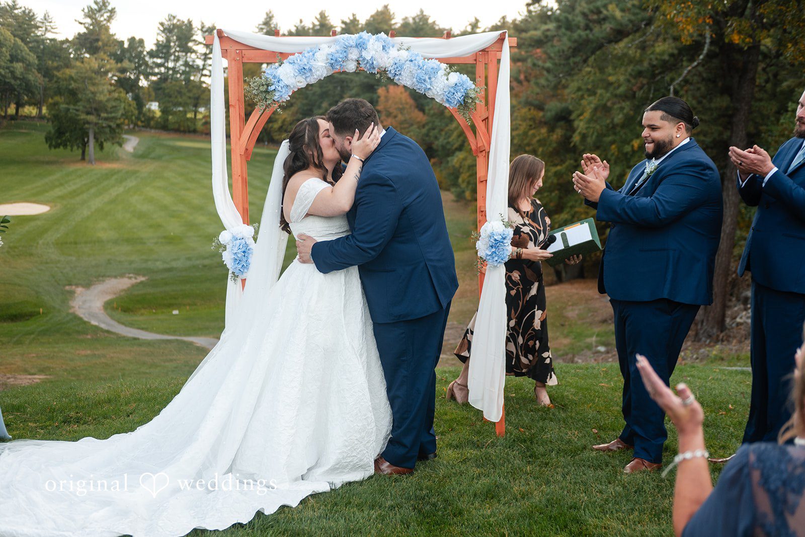 Erika and Daniel at the ceremony arch