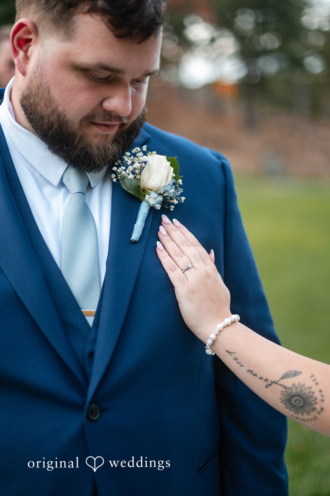 Bride touching the groom's shoulder