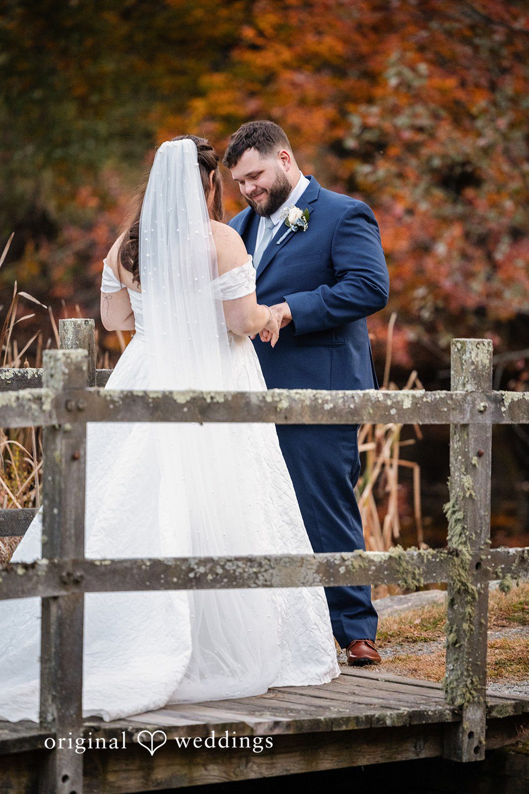 Couple by the wooden fence at Berlin Country Club