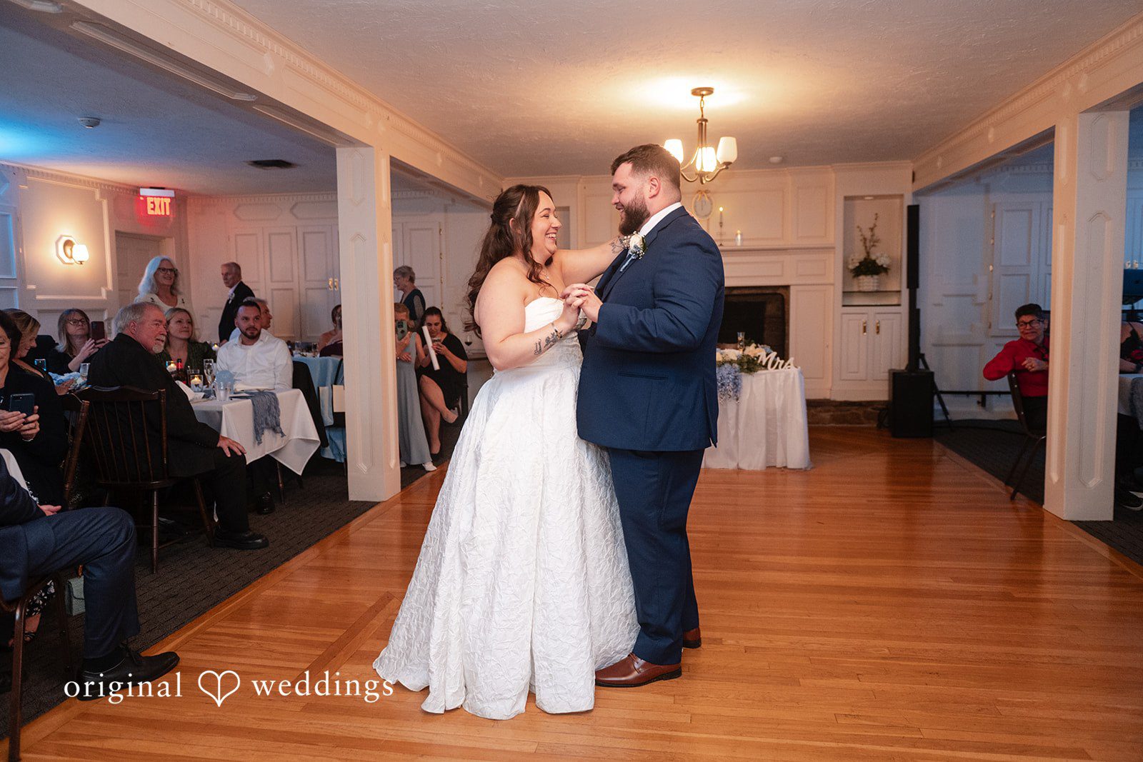 Couple dancing as guests watch at Berlin Country Club