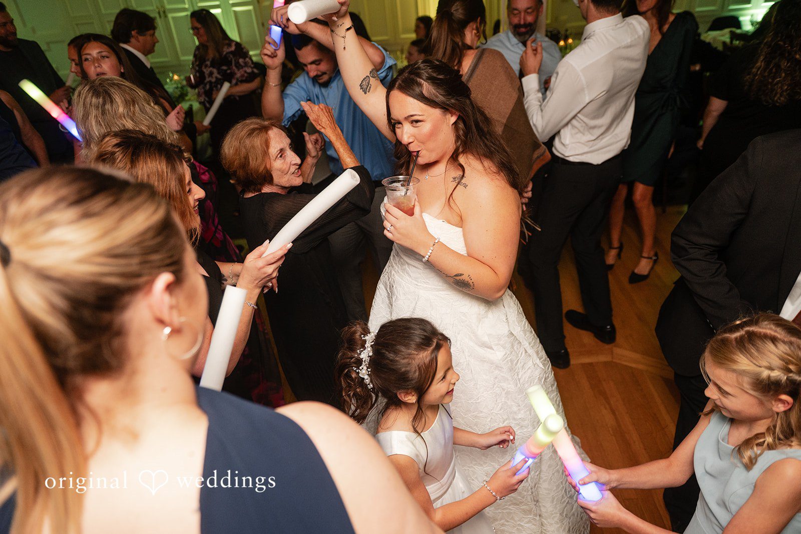 Guests dancing with the bride