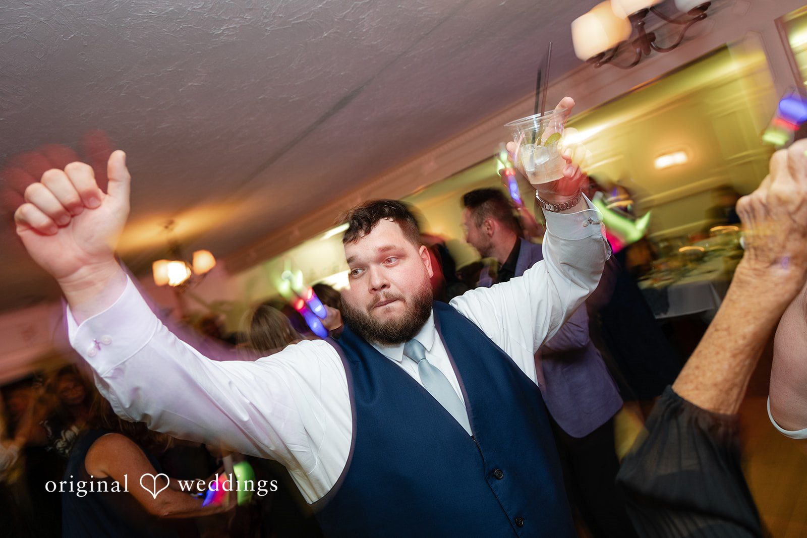 Groom celebrating on the dance floor