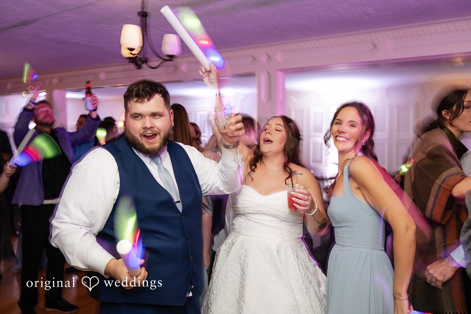 Couple dancing under purple lights