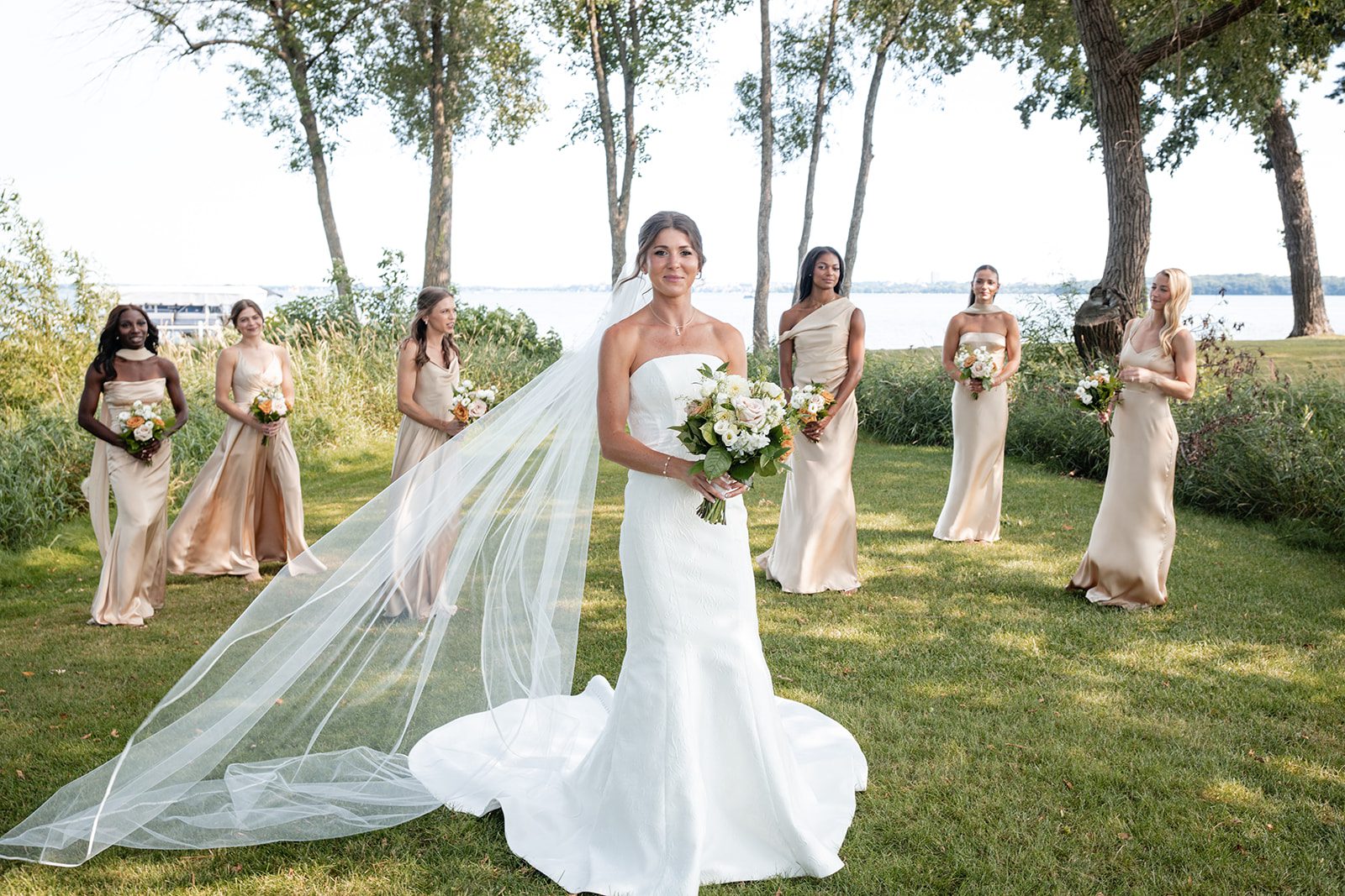 bishops-bay-country-club-timeless-madison-bianca-colin-p012-15 Bride with her veil flowing on the lawn