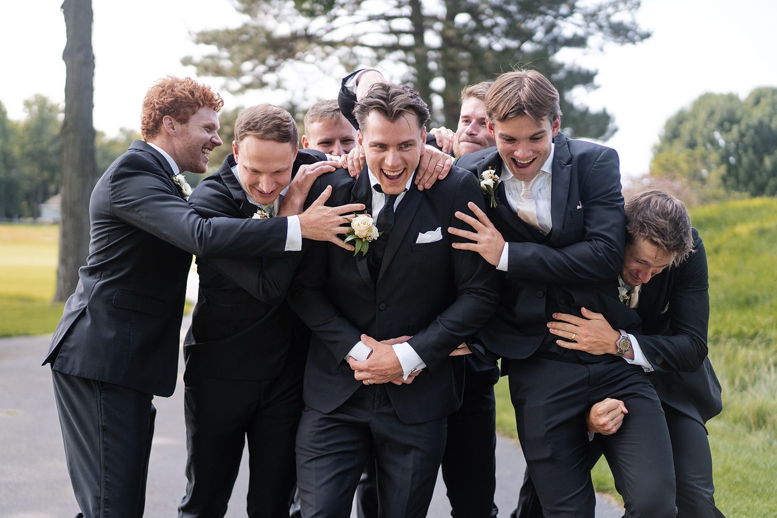 bishops-bay-country-club-timeless-madison-bianca-colin-p015-14 Groom celebrating with his groomsmen