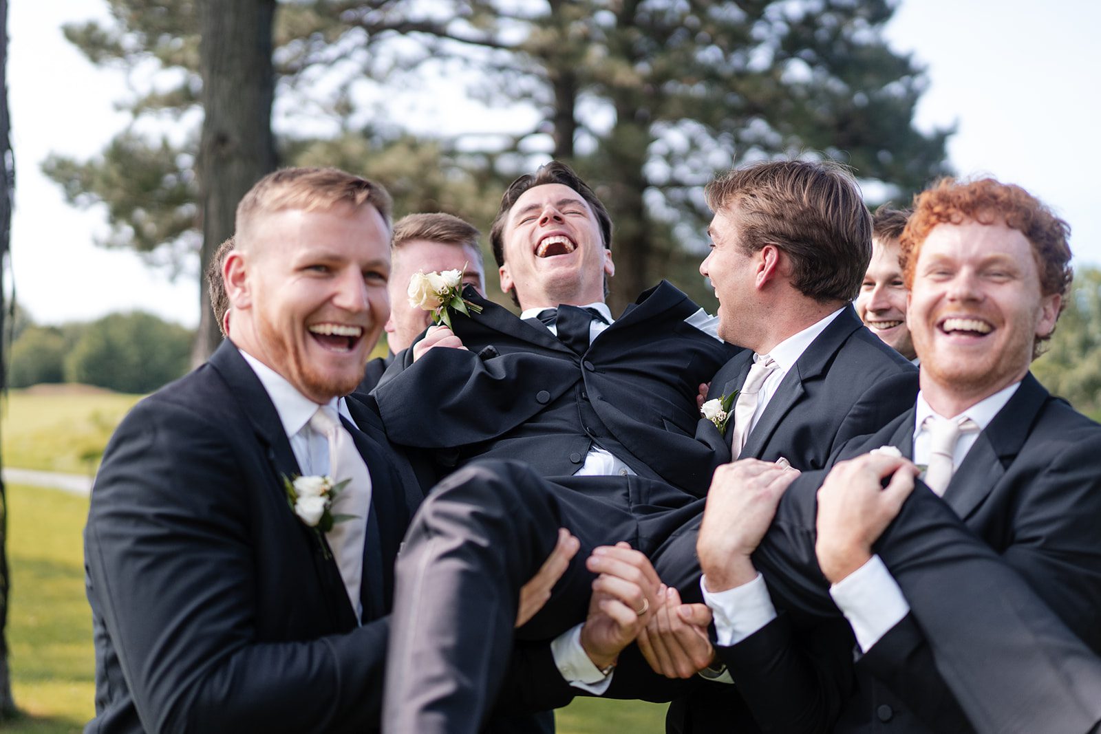 bishops-bay-country-club-timeless-madison-bianca-colin-p016-01 Groom laughing with his groomsmen