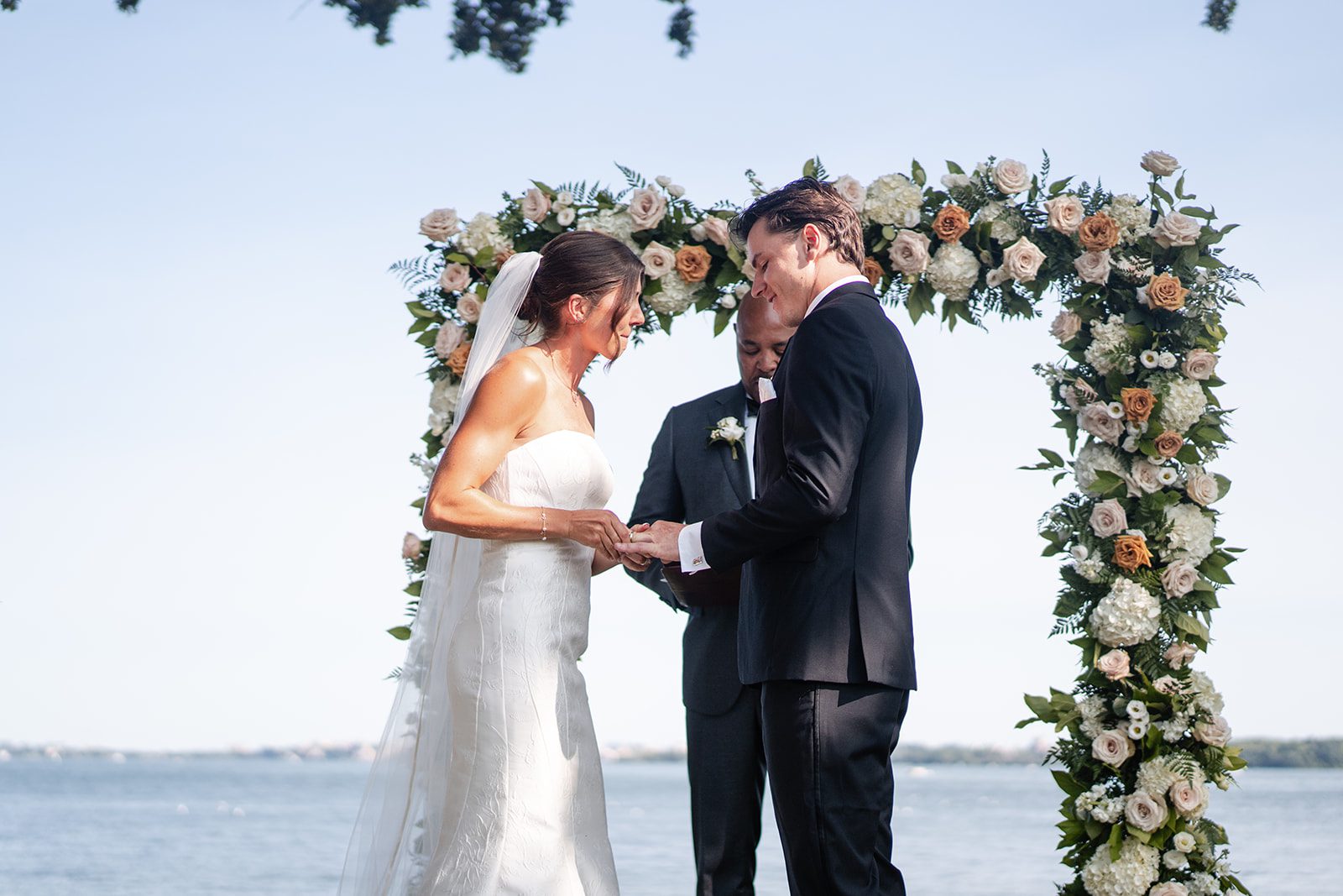 bishops-bay-country-club-timeless-madison-bianca-colin-p020-19 Couple at the floral arch by Lake Mendota