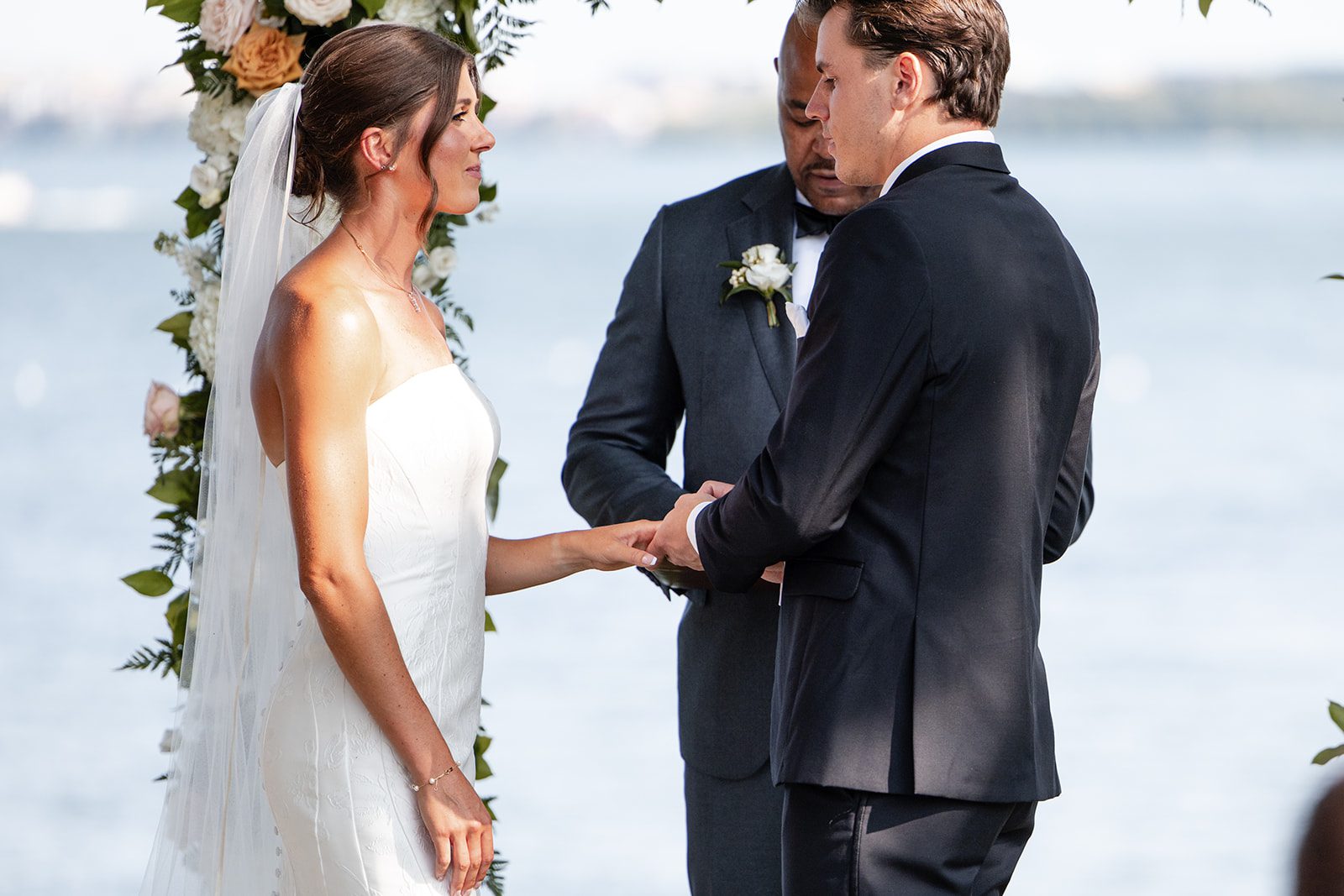 bishops-bay-country-club-timeless-madison-bianca-colin-p021-01 Bride and groom sharing vows by the lake