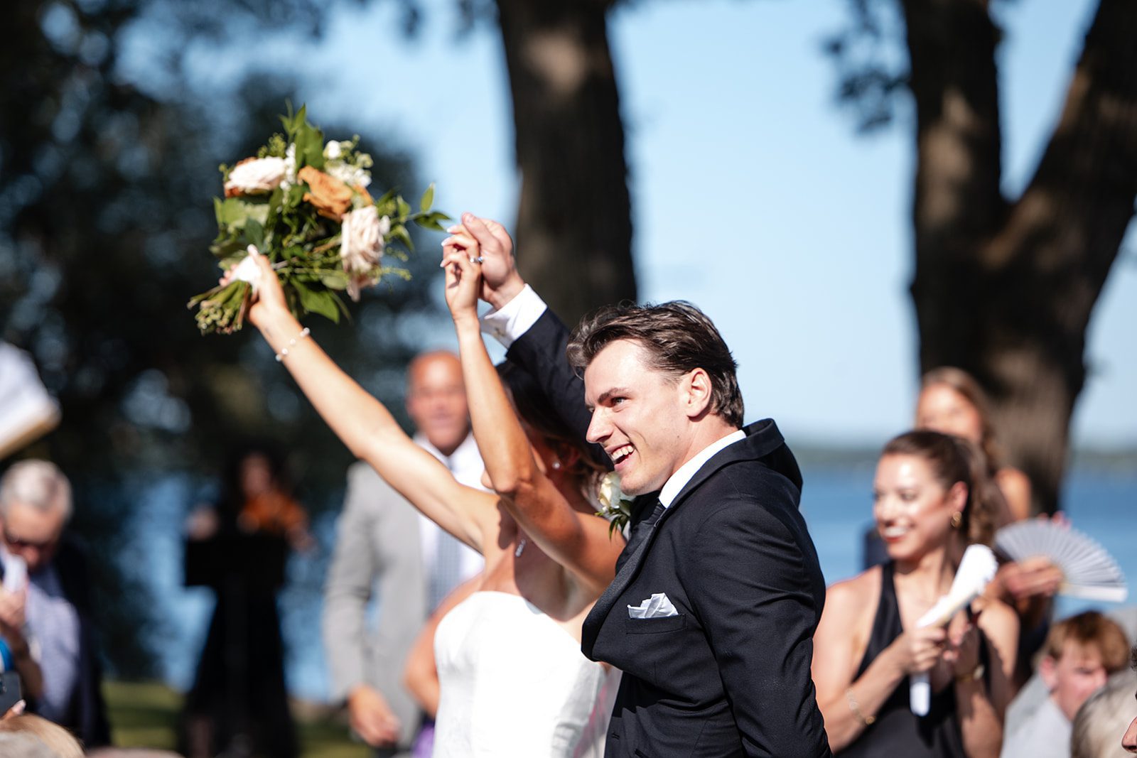bishops-bay-country-club-timeless-madison-bianca-colin-p025-01 Newlyweds celebrating down the aisle
