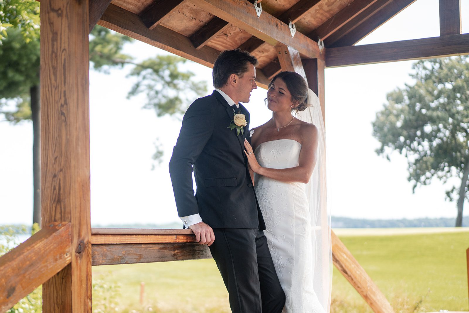 bishops-bay-country-club-timeless-madison-bianca-colin-p029-17 Couple under the wooden pergola
