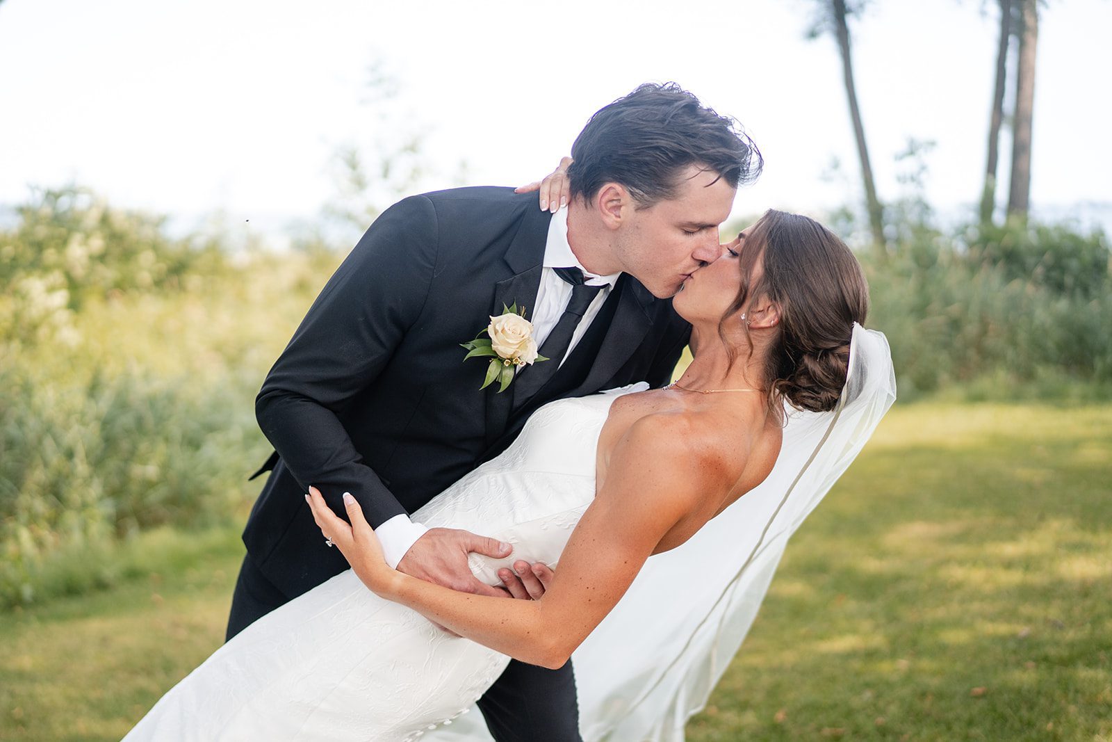 bishops-bay-country-club-timeless-madison-bianca-colin-p032-01 Groom dipping the bride on the lawn