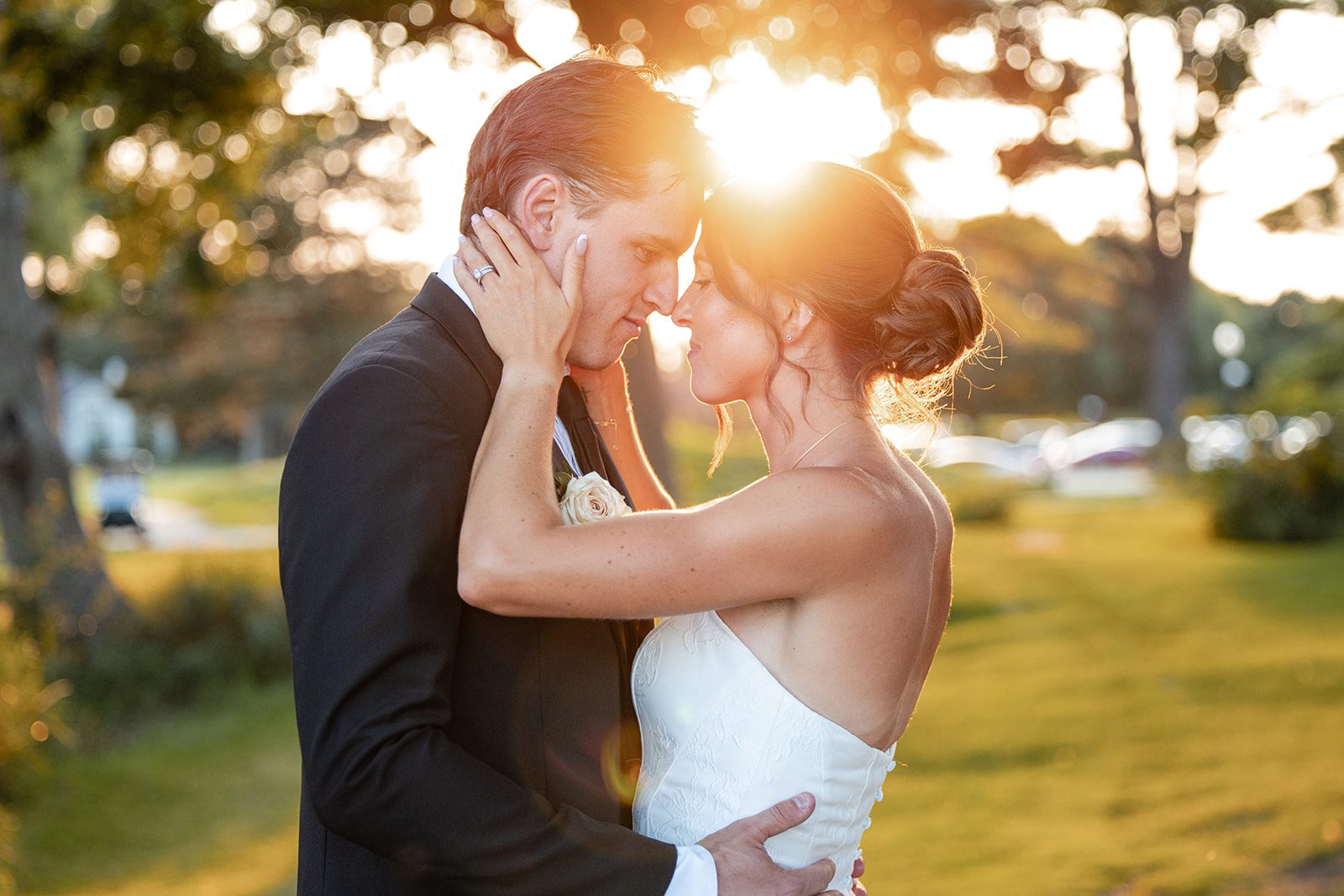 bishops-bay-country-club-timeless-madison-bianca-colin-p036-01 Bride and groom embracing in golden light, captured by Madison wedding photographers