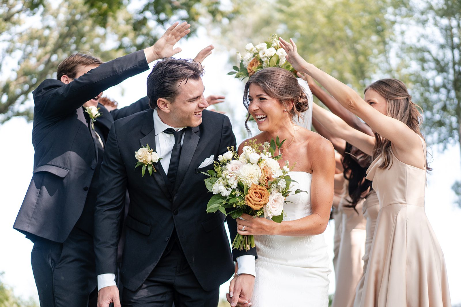 bishops-bay-country-club-timeless-madison-bianca-colin-p039-11 Wedding party celebrating with the couple