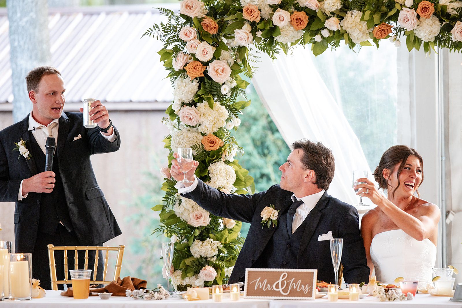 bishops-bay-country-club-timeless-madison-bianca-colin-p048-01 Couple at the sweetheart table under the flowers