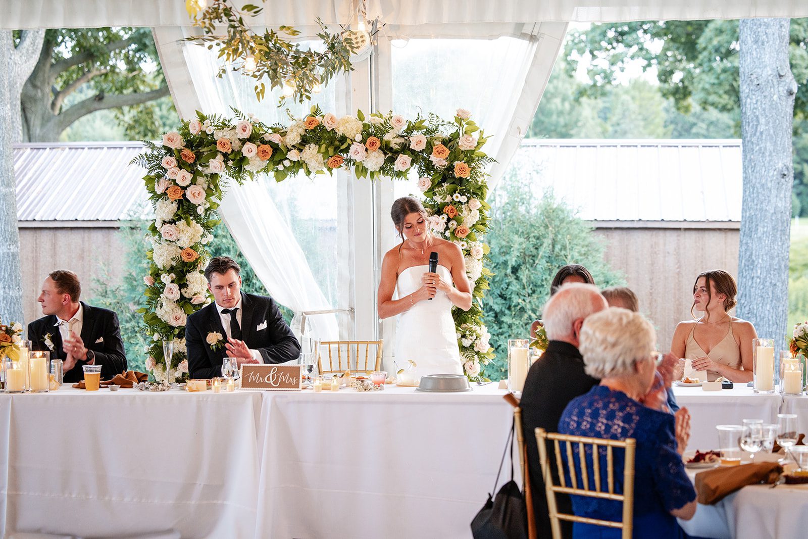 bishops-bay-country-club-timeless-madison-bianca-colin-p049-01 Head table with floral arch at Bishops Bay Country Club