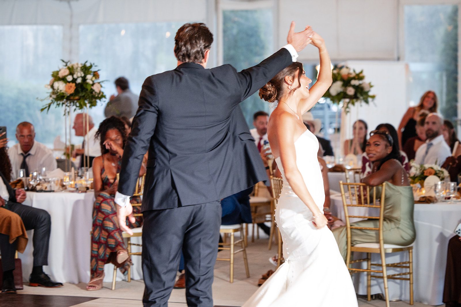 bishops-bay-country-club-timeless-madison-bianca-colin-p052-16 Groom spinning the bride on the dance floor