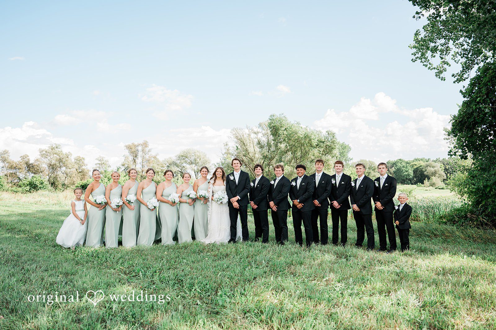 Our Cincinnati wedding photographers captured a beautiful portrait of the couple and their bridal party at Blossom and Hops